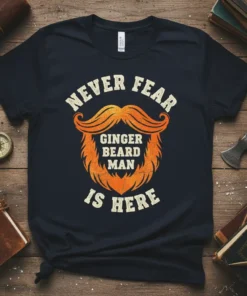 Never Fear Ginger Beard Man Is Here text with orange mustache and beard graphic on a navy t-shirt