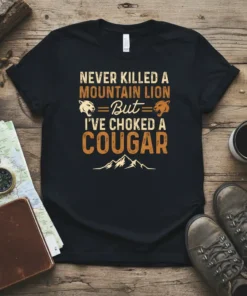 T-shirt with "Never Killed A Mountain Lion But I've Choked A Cougar" text and mountain lion graphics
