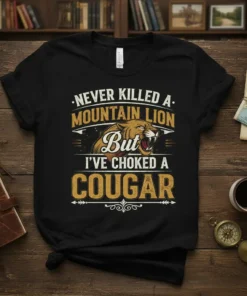 Never Killed a Mountain Lion But I've Choked a Cougar quote t-shirt with a fierce cougar graphic