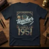 Never Underestimate A Teacher Born In 1951 vintage t-shirt design with an apple, book, and pencil graphic