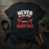 Black t-shirt with white and red text reading "NEVER AN OLD MAN WITH A BLACK BELT" and graphics of karate