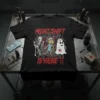 Black t-shirt with "NIGHT SHIFT IS HERE !!" in red distressed font, featuring cartoon skeleton nurse, zombie nurse, and ghost