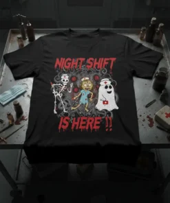 Black t-shirt with "NIGHT SHIFT IS HERE !!" in red distressed font, featuring cartoon skeleton nurse, zombie nurse, and ghost