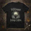 Nightmare Before Coffee quote on a black t-shirt with a spooky graveyard scene inside a coffee cup, featuring skeleton hands