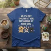 T-shirt with the quote "NO, I'M NOT SMILING AT YOU. I'M SMILING AT YOUR DOG." featuring three cartoon dogs: a