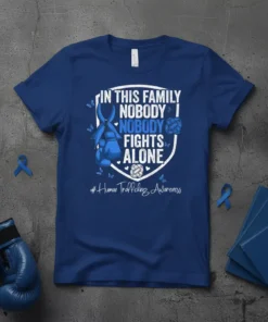 Blue t-shirt with text "In This Family Nobody Fights Alone" and #Human Trafficking Awareness, featuring boxing gloves and ribbon graphic