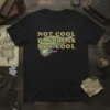 Black t-shirt with "Not Cool Pancreas Not Cool" text and a stylized pancreas graphic in green