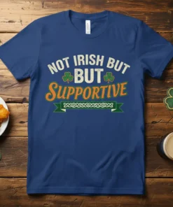Not Irish But Supportive text with shamrocks on a navy blue t-shirt for St. Patrick's Day