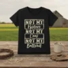 Black t-shirt with white text reading "NOT MY Pasture NOT MY Cous NOT MY Bullshit" in a vintage distressed font