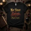 Not Today Satan Maybe tonight text with red and gold gothic font and devil horns graphic on a black t-shirt