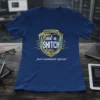 Blue t-shirt with "not a SNITCH just a mandated reporter" text inside a shield graphic with tech circuit board elements