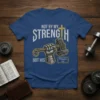 Christian t-shirt with text "Not By My Strength But His" and "Philippians 4:13", featuring a hand holding Thor's hammer and