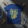 Blue t-shirt with yellow text "Nothing can stop me I'M ALL THE WAY UP" in a distressed font, promoting ambition