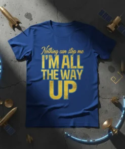 Blue t-shirt with yellow text "Nothing can stop me I'M ALL THE WAY UP" in a distressed font, promoting ambition