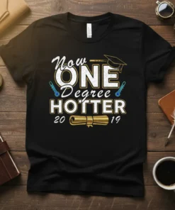 Black t-shirt with white and gold text reading "Now ONE Degree HOTTER 20 19" and graduation cap graphic