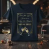 Dark t-shirt with gold text "Now We Sip Champagne When We Thirsty WHEN WE THIRSTY" and two champagne glasses toasting