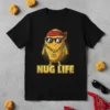 NUG LIFE text on a black t-shirt featuring a cartoon chicken nugget wearing sunglasses and a bandana, holding a dollar