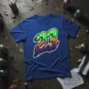 Blue t-shirt with a large '23' graphic in green, orange, and purple graffiti style, featuring cracked texture and subtle character