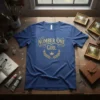 Blue t-shirt with gold text "Number One Girl" and a laurel wreath with a crown graphic