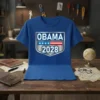 Obama 2028 presidential campaign t-shirt with shield logo featuring stars and stripes