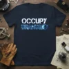 Occupy Uranus text with a planet graphic on a navy blue t-shirt, space exploration theme