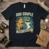 Odd Couple Aquatic Adventures t-shirt design with a capybara and shark graphic