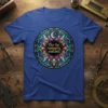 O'er the ramparts watched quote on a blue t-shirt with a circular stained-glass inspired design featuring a moon and stars