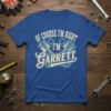 Blue t-shirt with "OF COURSE I'M RIGHT I'M Garrett" text and piston graphic