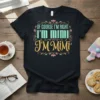 Black t-shirt with the quote "OF COURSE I'M RIGHT I'M MIMI I'M Mimi" in decorative teal and yellow lettering, framed