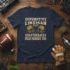 Offensive Lineman Because Quarterbacks Need Heroes Too quote on a navy t-shirt with football helmet graphics