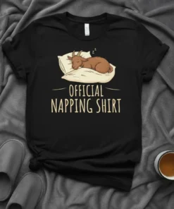 Official Napping Shirt design with a cute brown goat sleeping on a pillow, text reads "OFFICIAL NAPPING SHIRT"