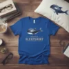 Official Sleepshirt Orca Whale T-Shirt with sleeping orca graphic and gold text
