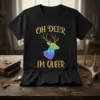 Black t-shirt with "Oh Deer I'm Queer" text and a geometric deer in rainbow colors, representing LGBTQ pride