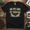 Black t-shirt with "OH MY GOD MY SHAYLAAA" in bold gold lettering, surrounded by a laurel wreath graphic