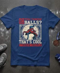 Wrestler graphic with text "OH YOU THROW BALLS? THAT'S COOL I THROW PEOPLE" on a navy blue t-shirt