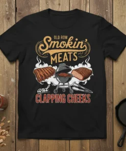 Black t-shirt with "OLD ROW Smokin' MEATS and CLAPPING CHEEKS" text, featuring ribs, a grill, and steak graphic