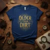 Older Than Dirt text design with vintage tree roots graphic on a navy blue t-shirt