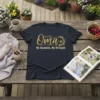 Oma My Sunshine, My Strength quote t-shirt in gold glitter font with floral wreath accent