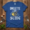 Omelette That Slide text design on a blue t-shirt with a frying pan and omelette graphic