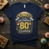 OMG! IT'S MY GRANDMA'S 80th Birthday T-Shirt with gold glitter text and rainbow accents