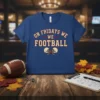 Blue t-shirt with red and cream text "ON FRIDAYS WE FOOTBALL" and vintage football helmets graphic