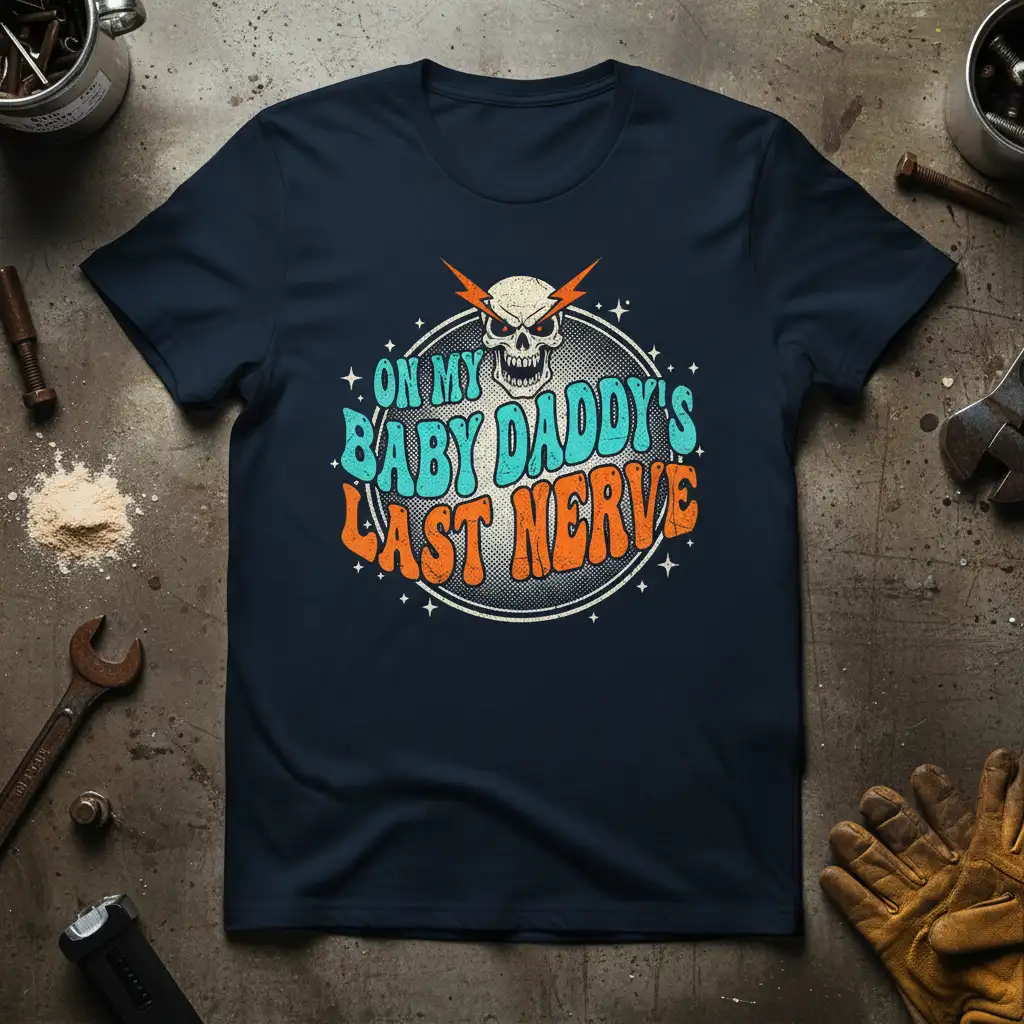 On My Baby Daddy's Last Nerve quote with skull graphic and retro typography on a navy t-shirt