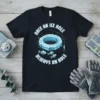 Black t-shirt with "Once An Ice Hole Always An Hole" text, ice hole graphic, and fish illustration