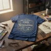 Once In A While A Cool Grandma Comes Along Here I Am quote on a navy blue t-shirt with gold
