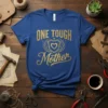 Gold text "ONE TOUGH Mother" with shield and heart graphic on a royal blue t-shirt