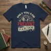 Only You Can Prevent Fascism text design on a navy blue t-shirt with a raised fist graphic and chained figures