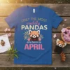 Only the Most Cuddly Pandas Are Born In April text with a cute red panda graphic on a blue t-shirt