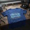 Orth Squad text with tooth graphic on a blue t-shirt, surrounded by dental braces and circuitry elements