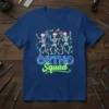 Ortho Squad Christmas t-shirt design with dancing skeletons wearing Santa hats and wrapped in colorful lights