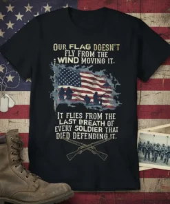 Patriotic t-shirt with text "Our Flag Doesn't Fly From The Wind Moving It. It Flies From The Last Breath Of